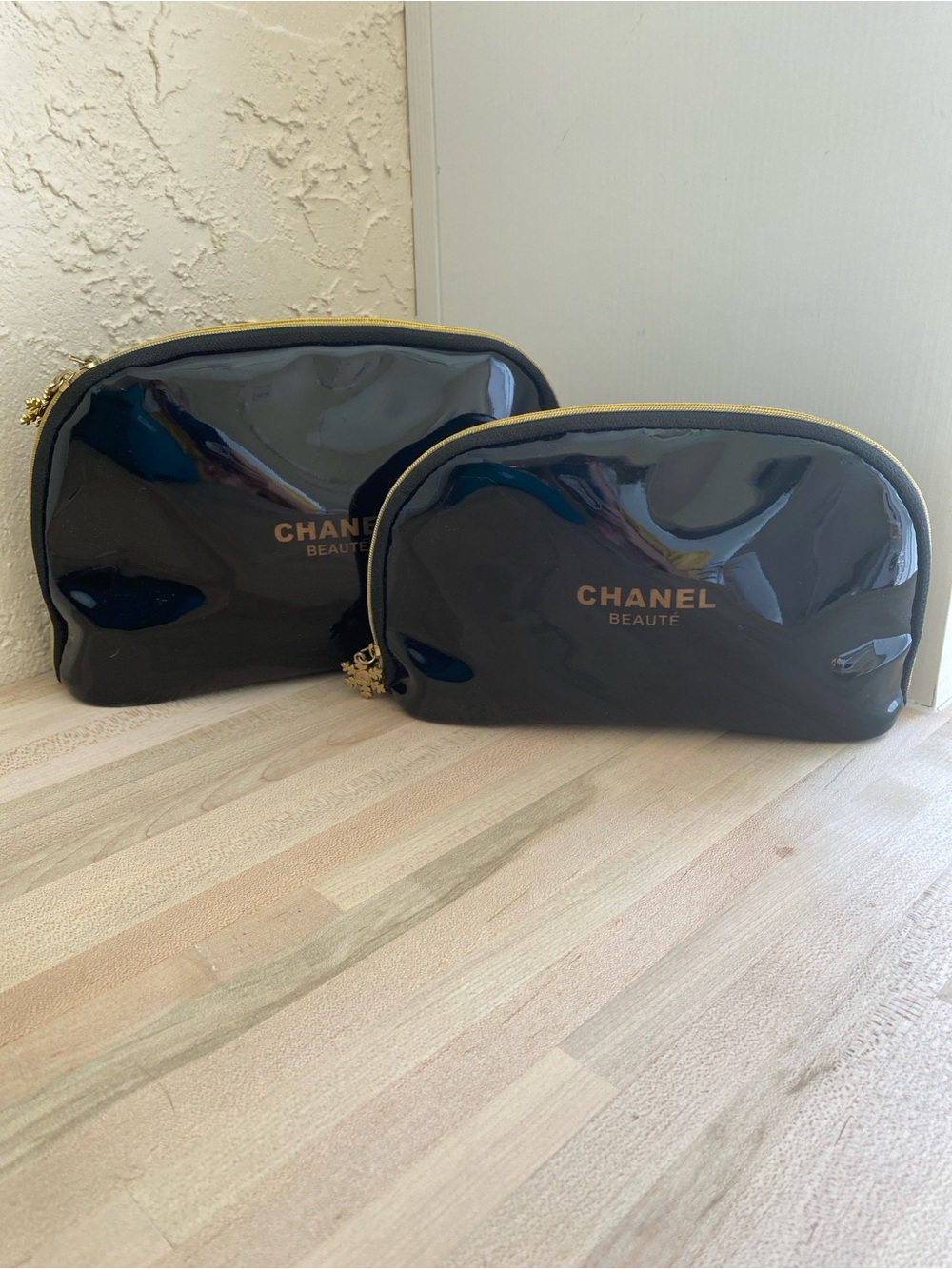 CHANEL Black Patent Cosmetic Pouch with Gold Zip Accents